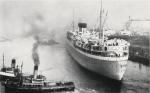 Pulling a liner from her berth in a river