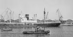 Unknown ship and tug